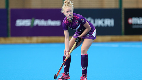 Female athlete playing hockey